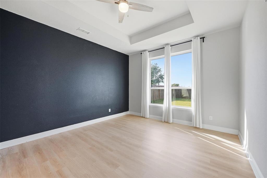 2013 Historic District Aubrey, TX 76227 - Photo 11 of 25 a view of empty room with a ceiling fan