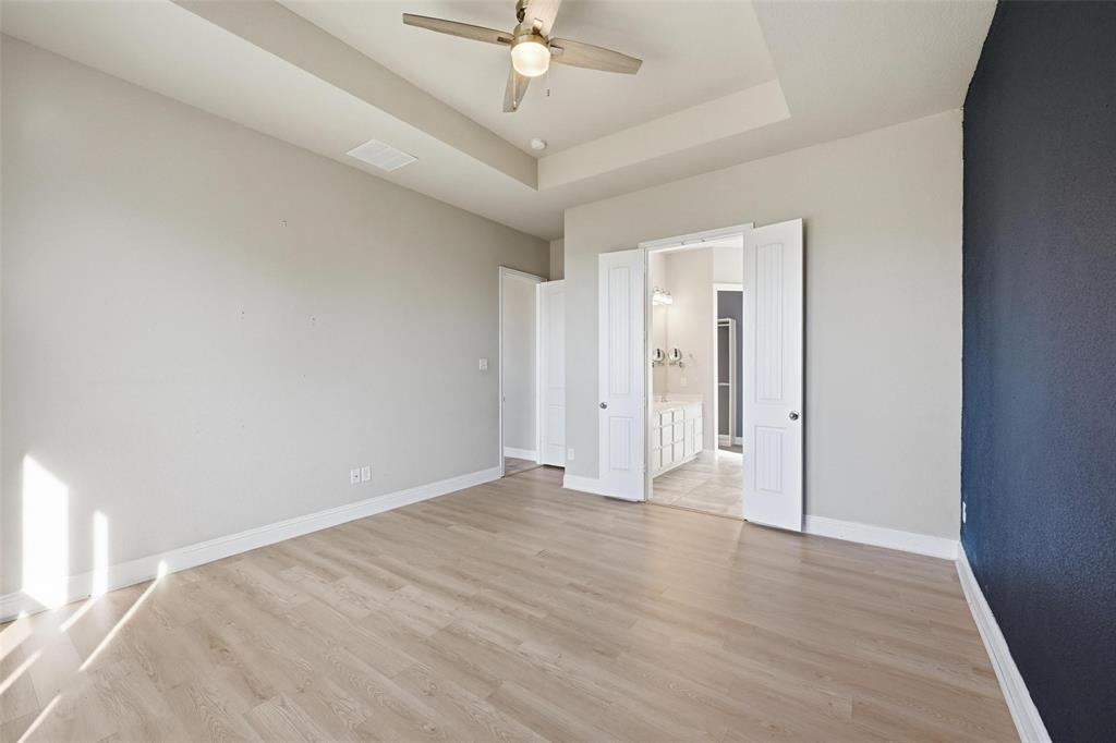 2013 Historic District Aubrey, TX 76227 - Photo 12 of 25 a view of an empty room with a chandelier fan