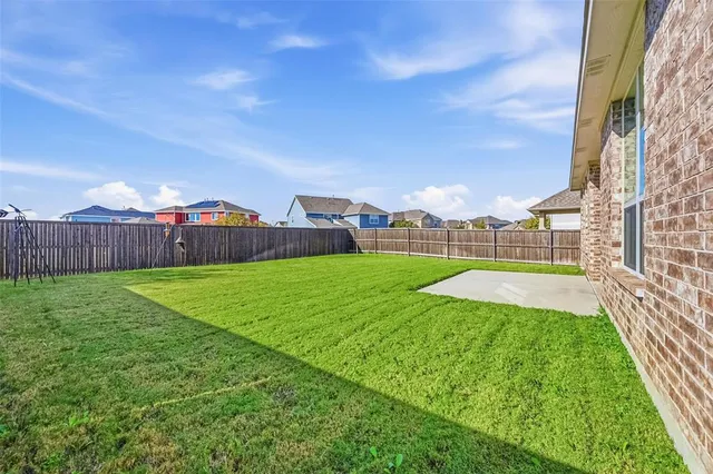 a view of yard with swimming pool and deck in the back