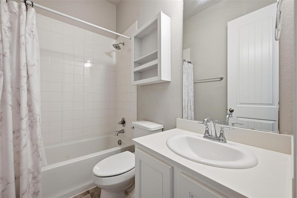 2013 Historic District Aubrey, TX 76227 - Photo 3 of 25 a bathroom with a sink toilet and shower