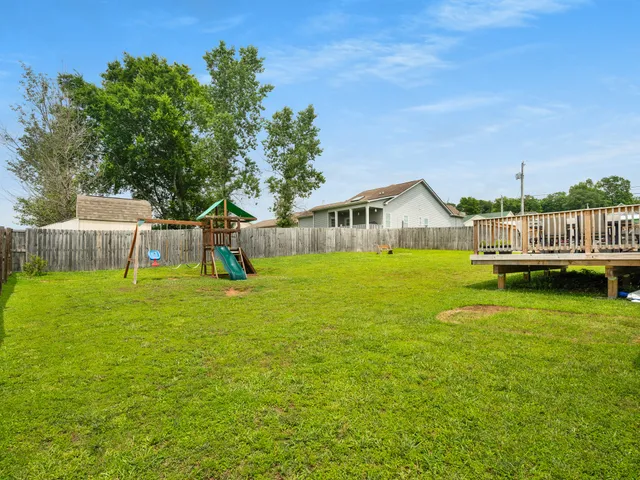 a view of house with swimming pool