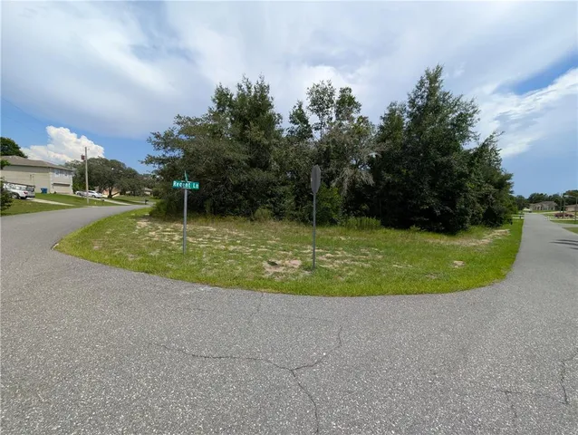 a view of a golf course with a lake