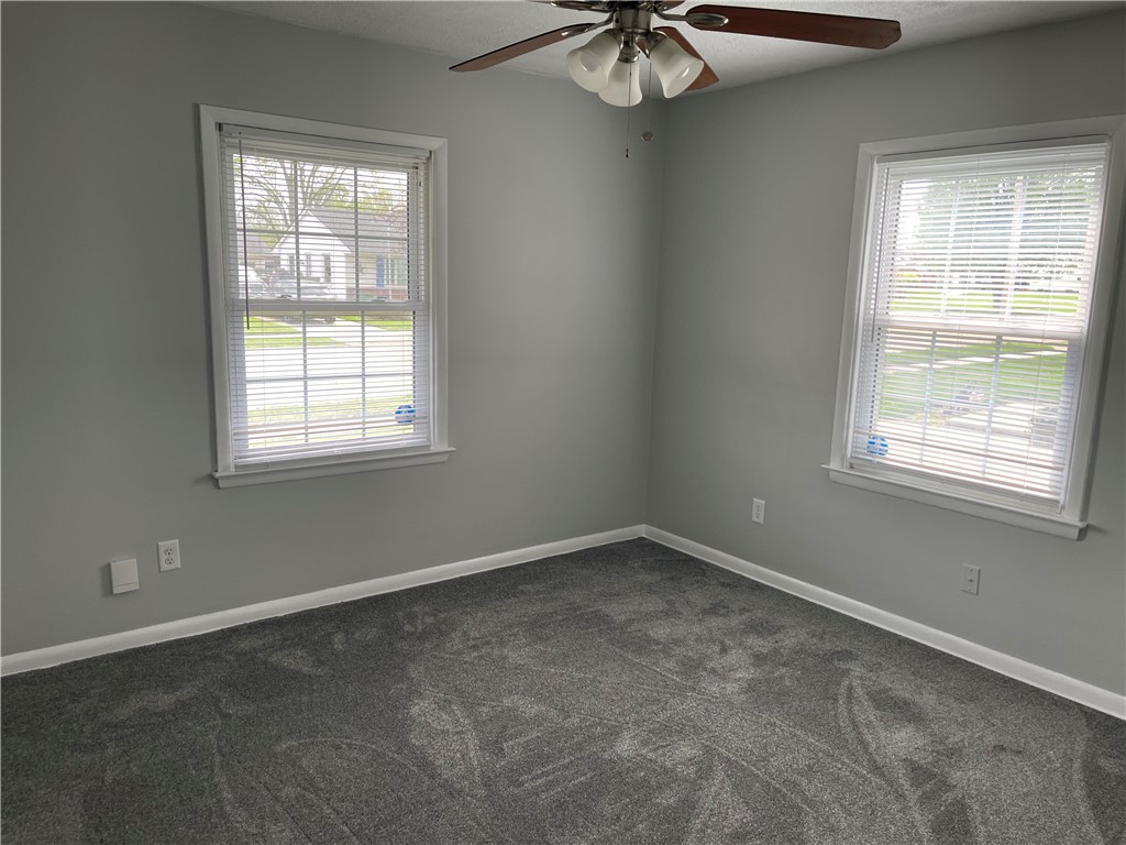 1361 Sussex Road Troy, OH 45373 - Photo 3 of 25 This cozy bedroom features plush carpeting and abundant natural light.