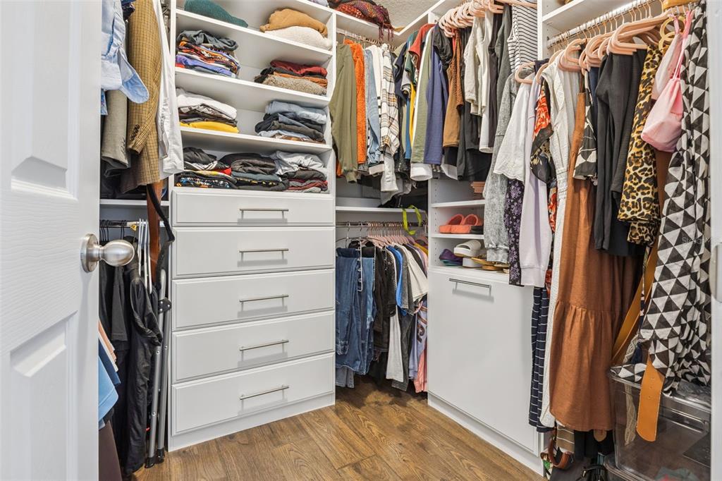 15448 Blackbead Street Winter Garden, FL 34787 - Photo 16 of 28 a view of walk in closet with clothes and shoes