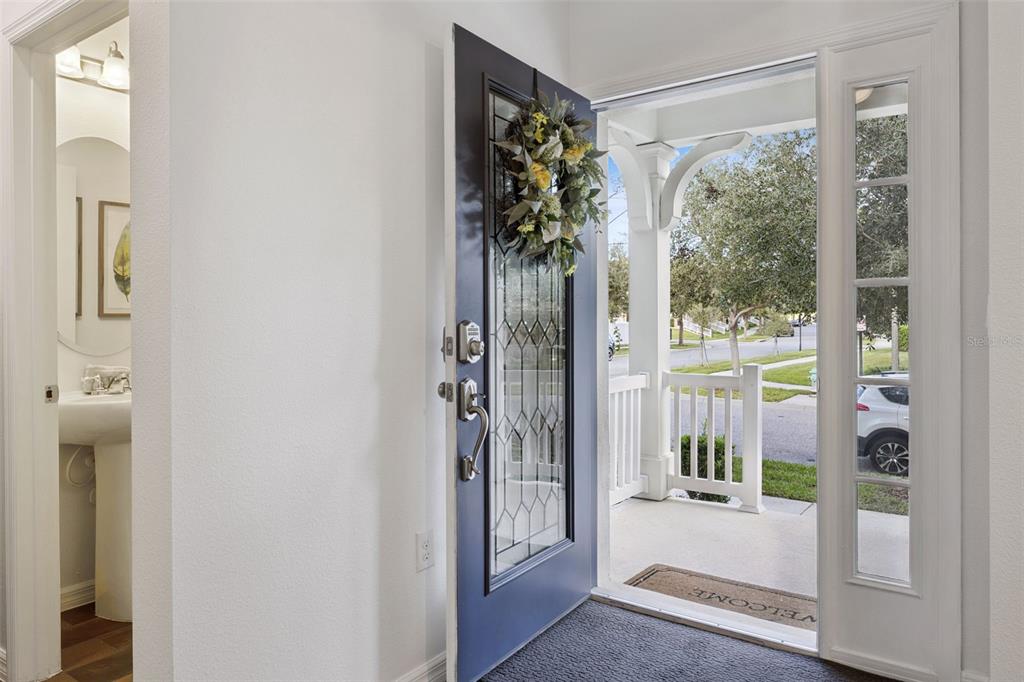 15448 Blackbead Street Winter Garden, FL 34787 - Photo 3 of 28 a view of a porch with a glass door