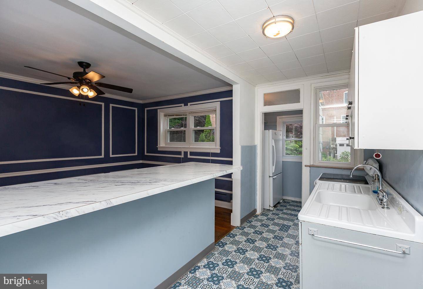 6609 Morris Park Road Philadelphia, PA 19151 - Photo 12 of 35 a kitchen with a stove and a sink