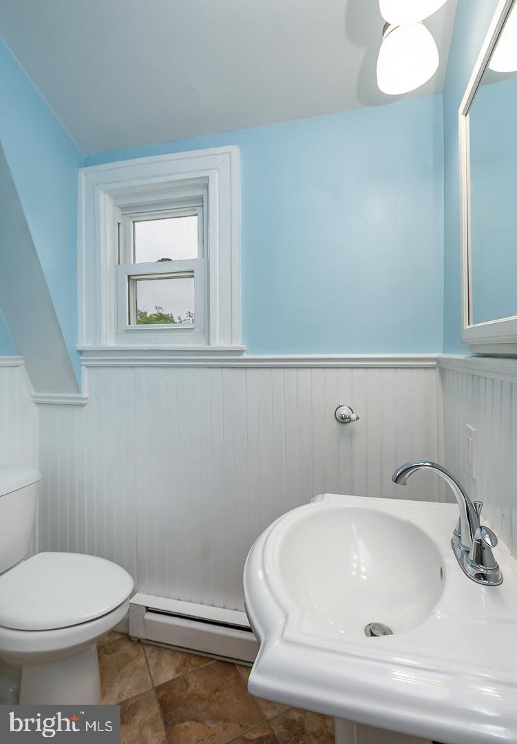 6609 Morris Park Road Philadelphia, PA 19151 - Photo 25 of 35 a bathroom with a sink and a toilet