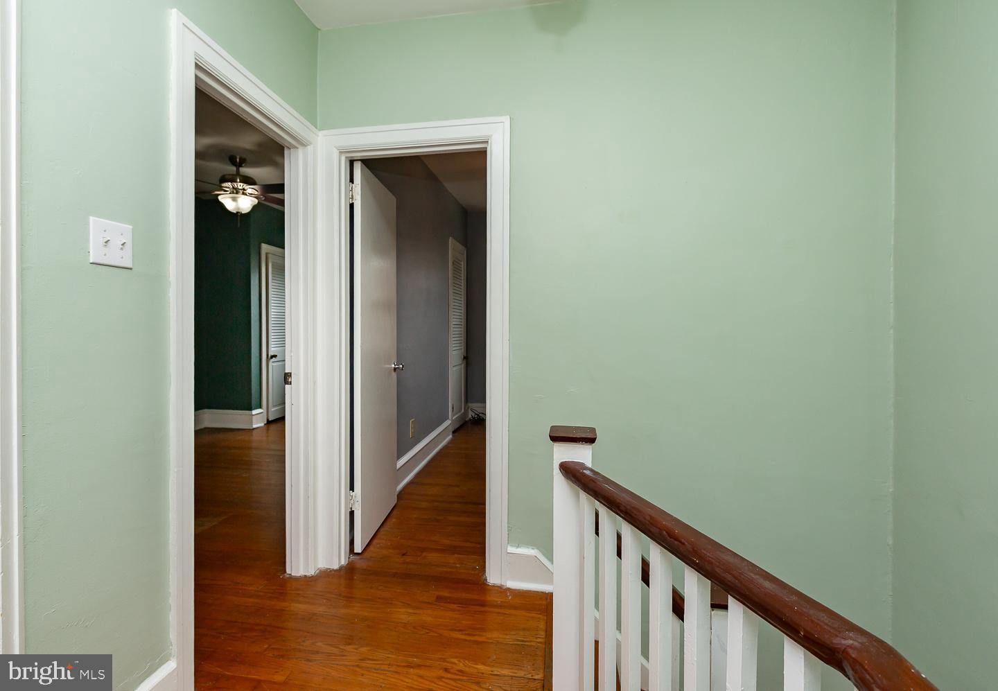 6609 Morris Park Road Philadelphia, PA 19151 - Photo 27 of 35 a view of a hallway with wooden floor and staircase