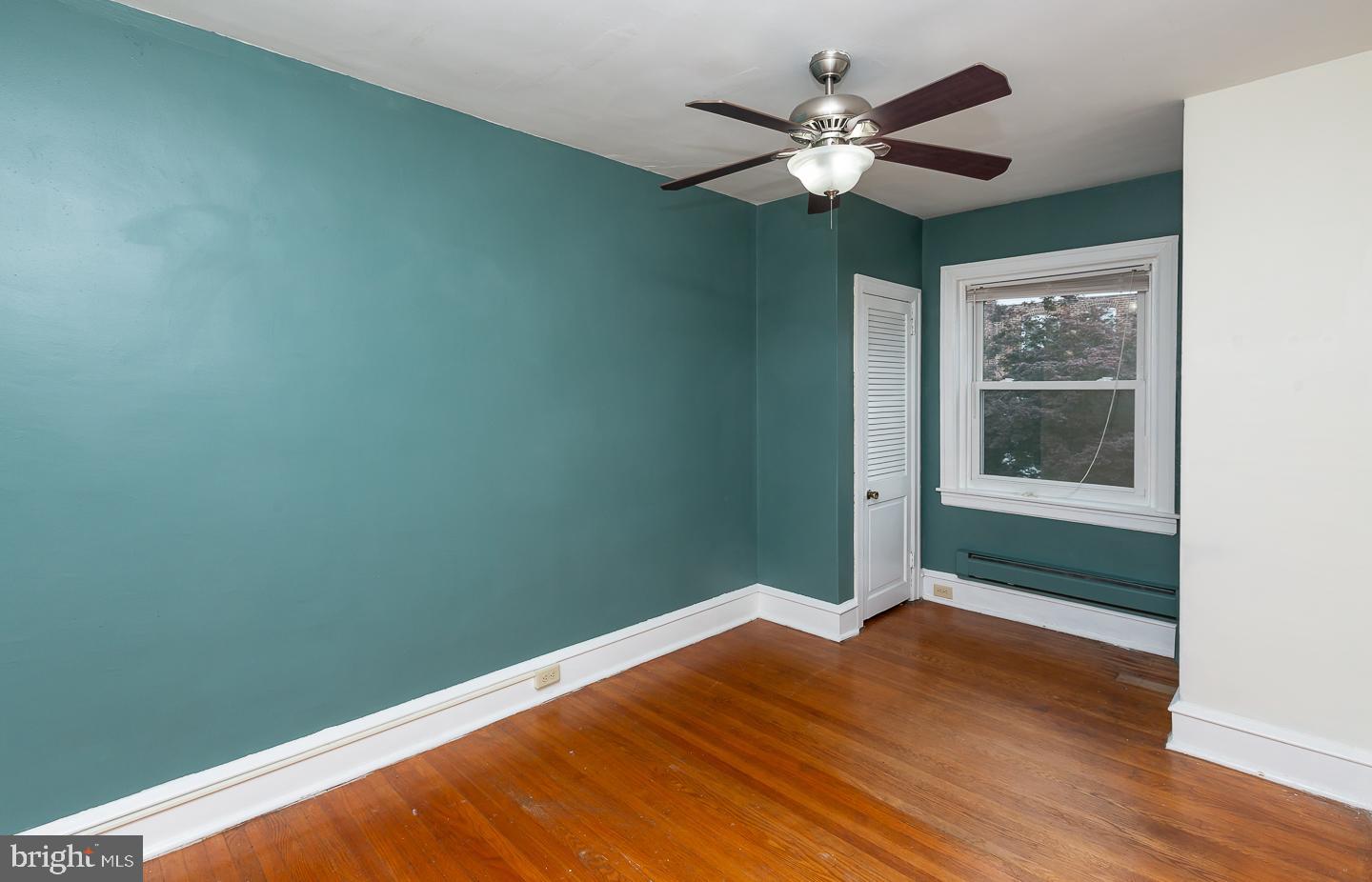 6609 Morris Park Road Philadelphia, PA 19151 - Photo 30 of 35 wooden floor in an empty room with a window
