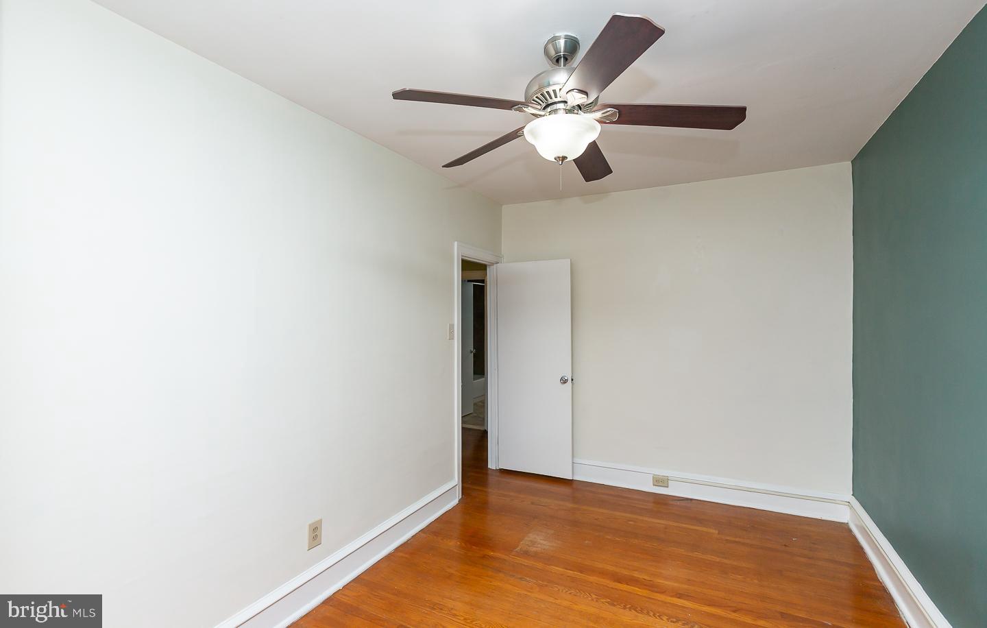 6609 Morris Park Road Philadelphia, PA 19151 - Photo 31 of 35 a view of an empty room with wooden floor