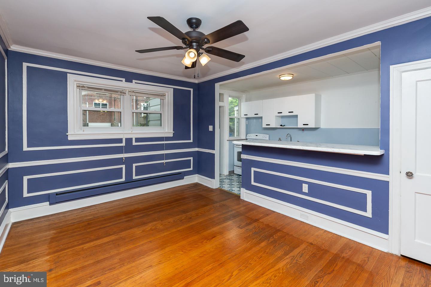 6609 Morris Park Road Philadelphia, PA 19151 - Photo 7 of 35 a view of room with a ceiling fan and wooden floor
