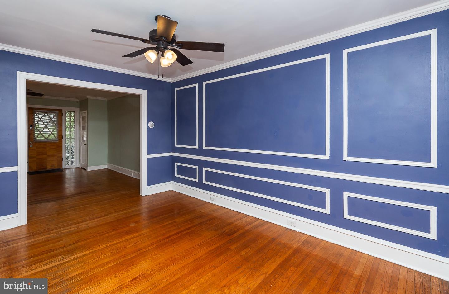 6609 Morris Park Road Philadelphia, PA 19151 - Photo 10 of 35 a view of an empty room with wooden floor and a ceiling fan