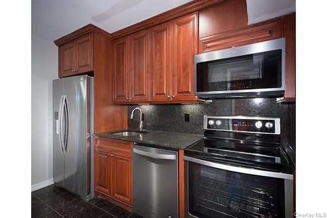 a kitchen with a stove microwave and refrigerator