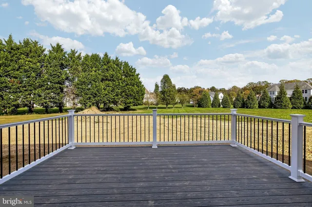 a view of a house with wooden deck