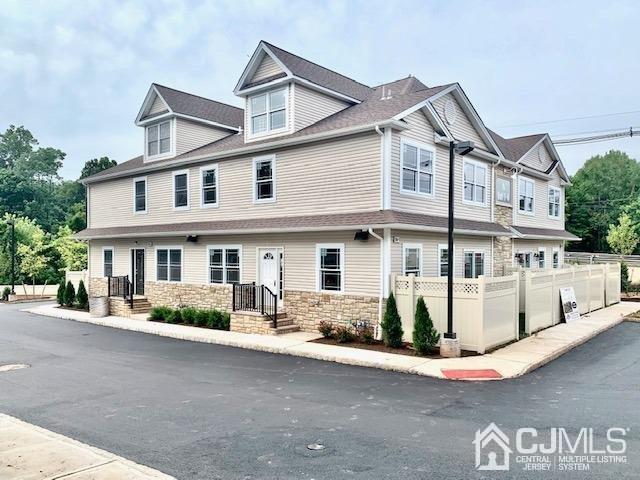 144 Harding Avenue, Unit 2 Edison, NJ 08820 - Photo 3 of 12 a front view of a house with a street