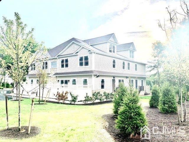 144 Harding Avenue, Unit 2 Edison, NJ 08820 - Photo 4 of 12 a front view of a house with swimming pool
