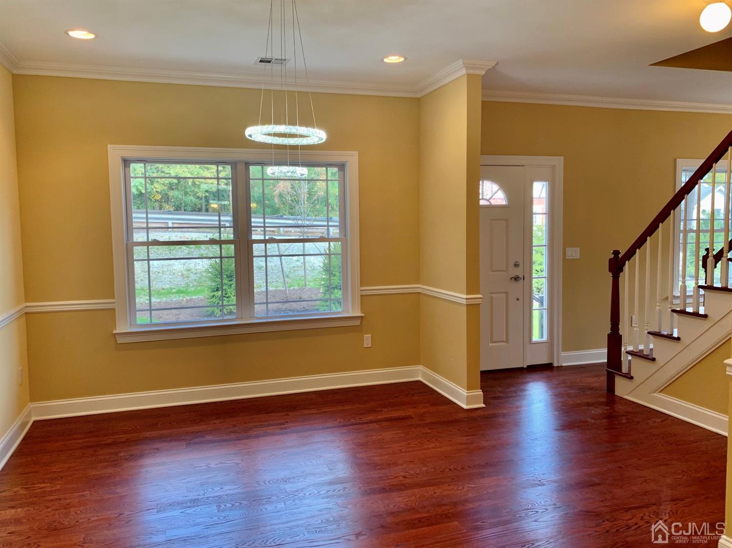 144 Harding Avenue, Unit 2 Edison, NJ 08820 - Photo 6 of 12 a view of a room with wooden floor and outdoor view