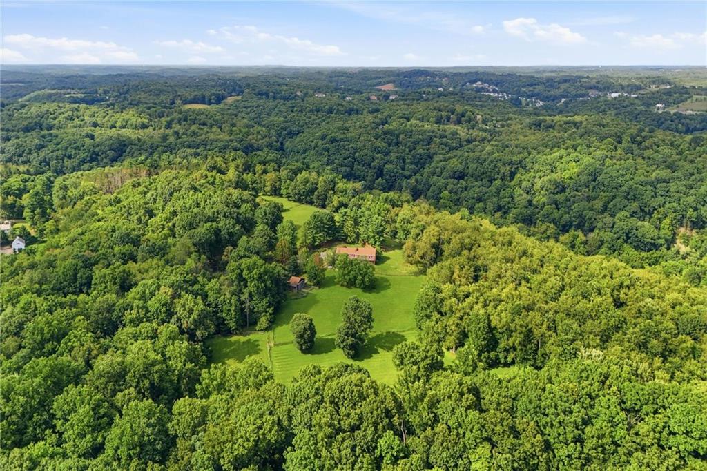45 Stonedale Road Sewickley, PA 15143 - Photo 26 of 26 An expansive aerial view showcases the estate’s 69 acres of rolling pastures, mature woods, and total seclusion in Sewickley Hills. It’s the perfect opportunity to build your dream home in Sewickley Hills surrounded by prestigious Sewickley Heights Estates.