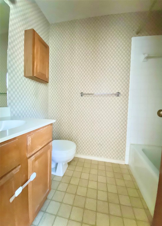 7808 Topawa Cove, Unit B Austin, TX 78729 - Photo 10 of 10 a bathroom with a sink a toilet and a mirror