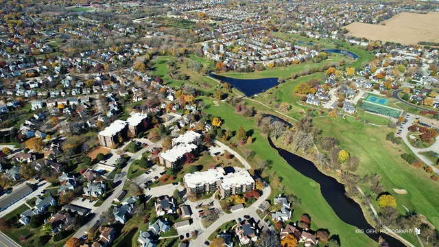 an aerial view of residential houses with outdoor space