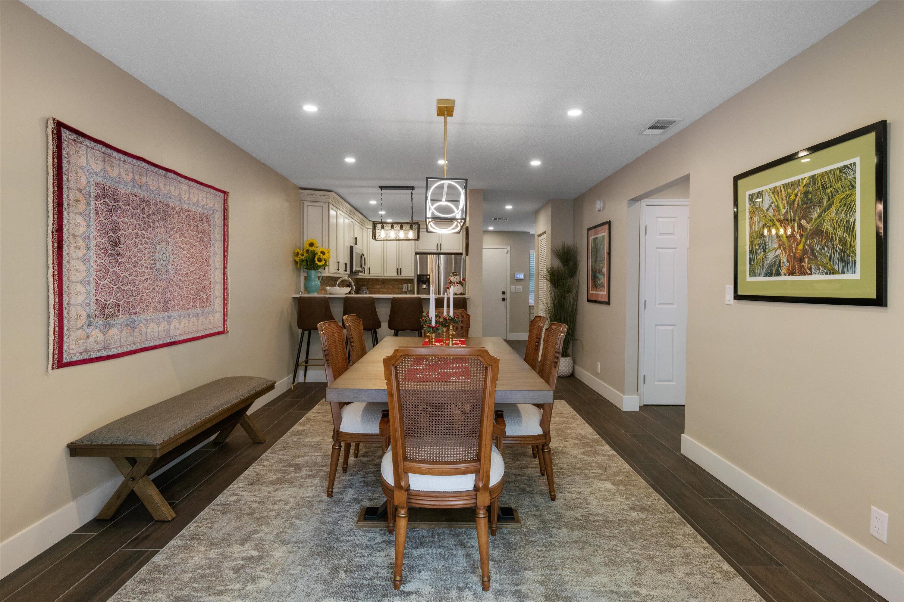 8878 Southeast Riverfront Terrace Jupiter, FL 33469 - Photo 14 of 57 a dining room with furniture and window