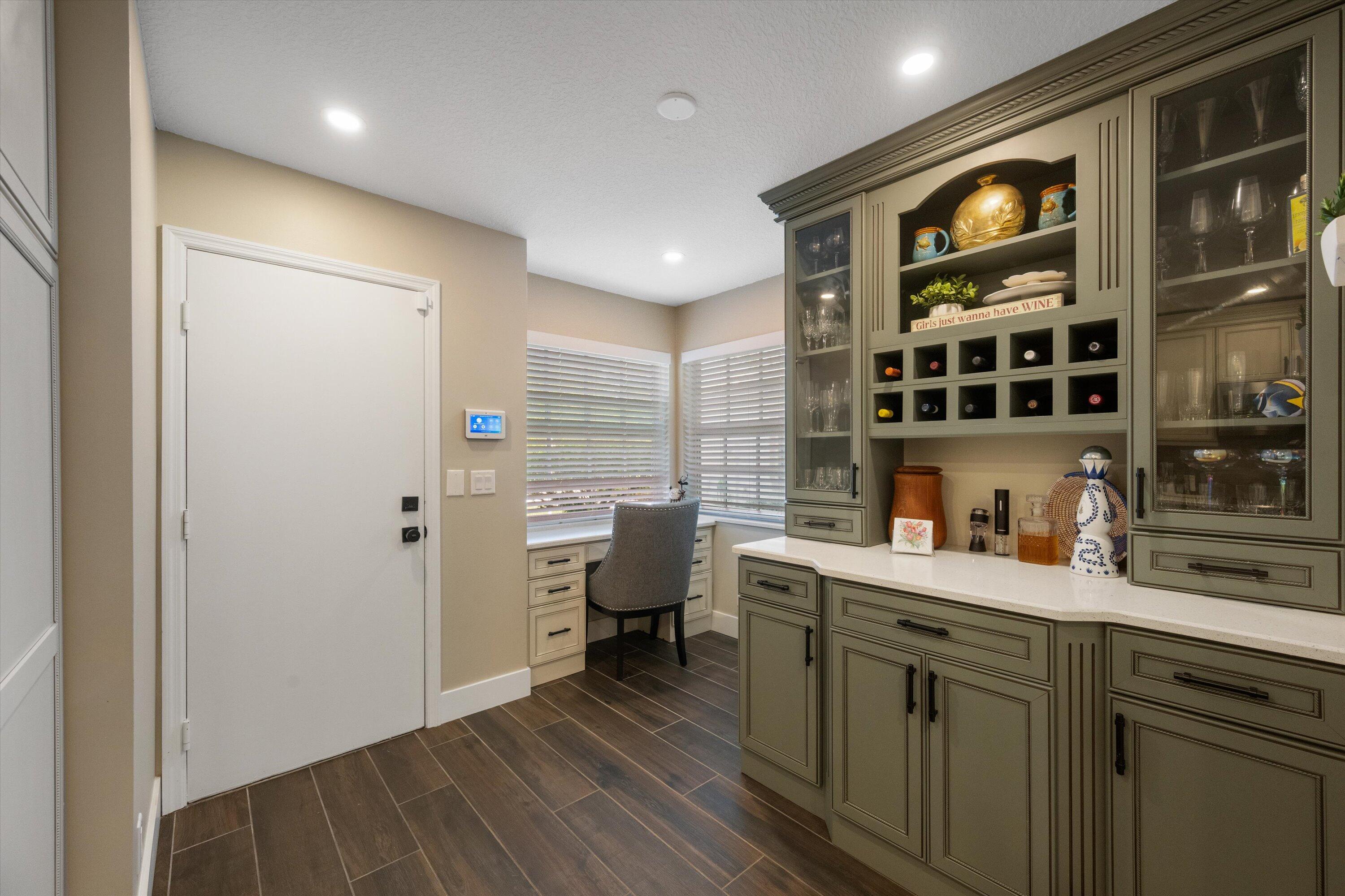 8878 Southeast Riverfront Terrace Jupiter, FL 33469 - Photo 18 of 57 a kitchen with a sink and cabinets