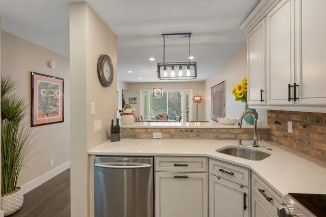 a view of a hallway with a couch and stairs