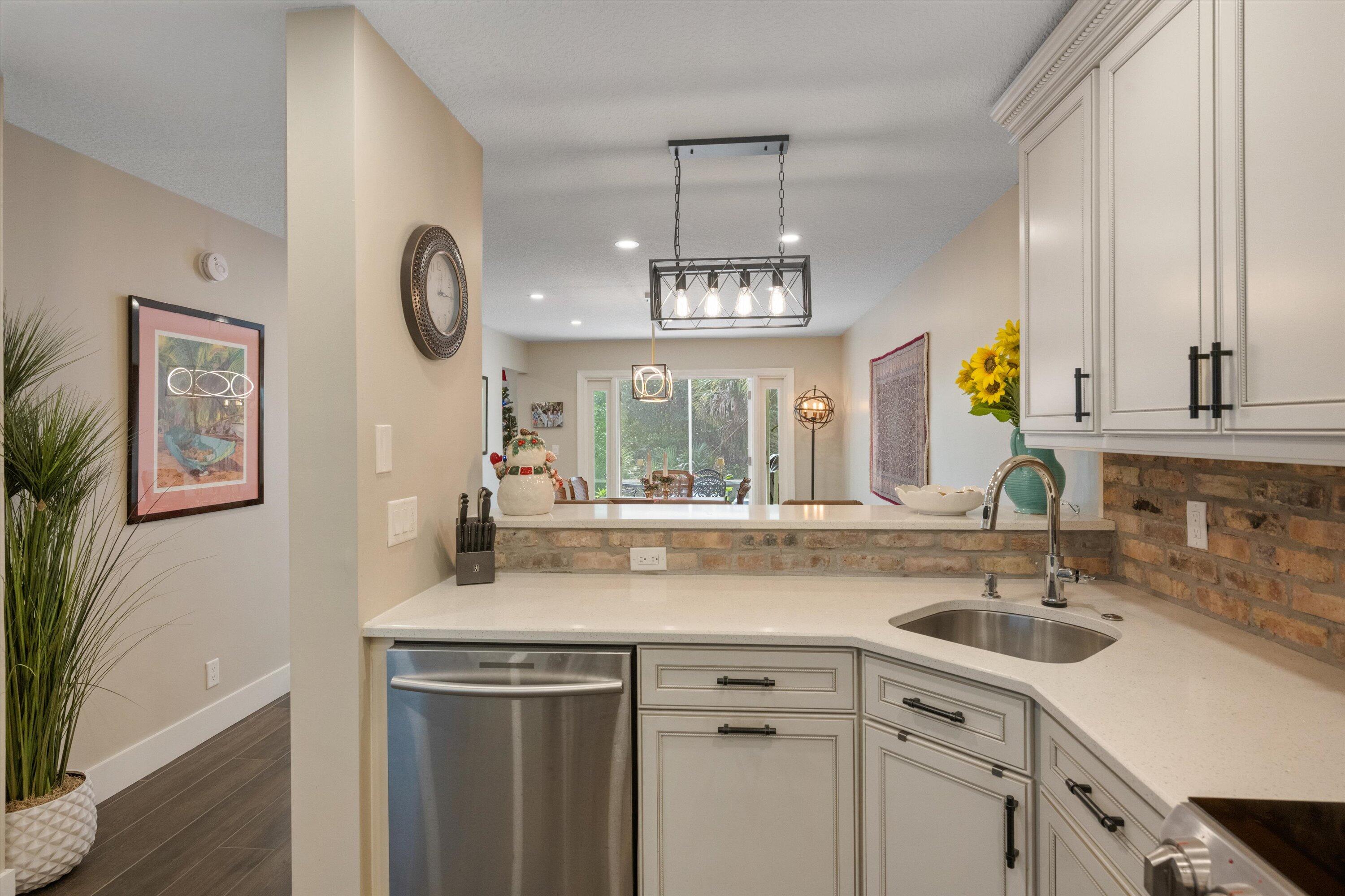 8878 Southeast Riverfront Terrace Jupiter, FL 33469 - Photo 20 of 57 a kitchen with a sink and a window