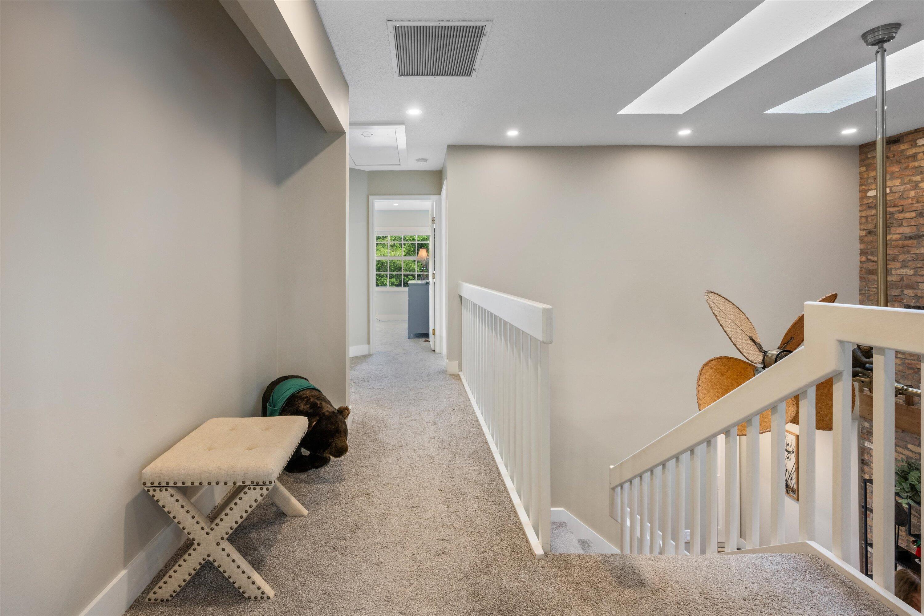 8878 Southeast Riverfront Terrace Jupiter, FL 33469 - Photo 23 of 57 a view of a hallway with staircase