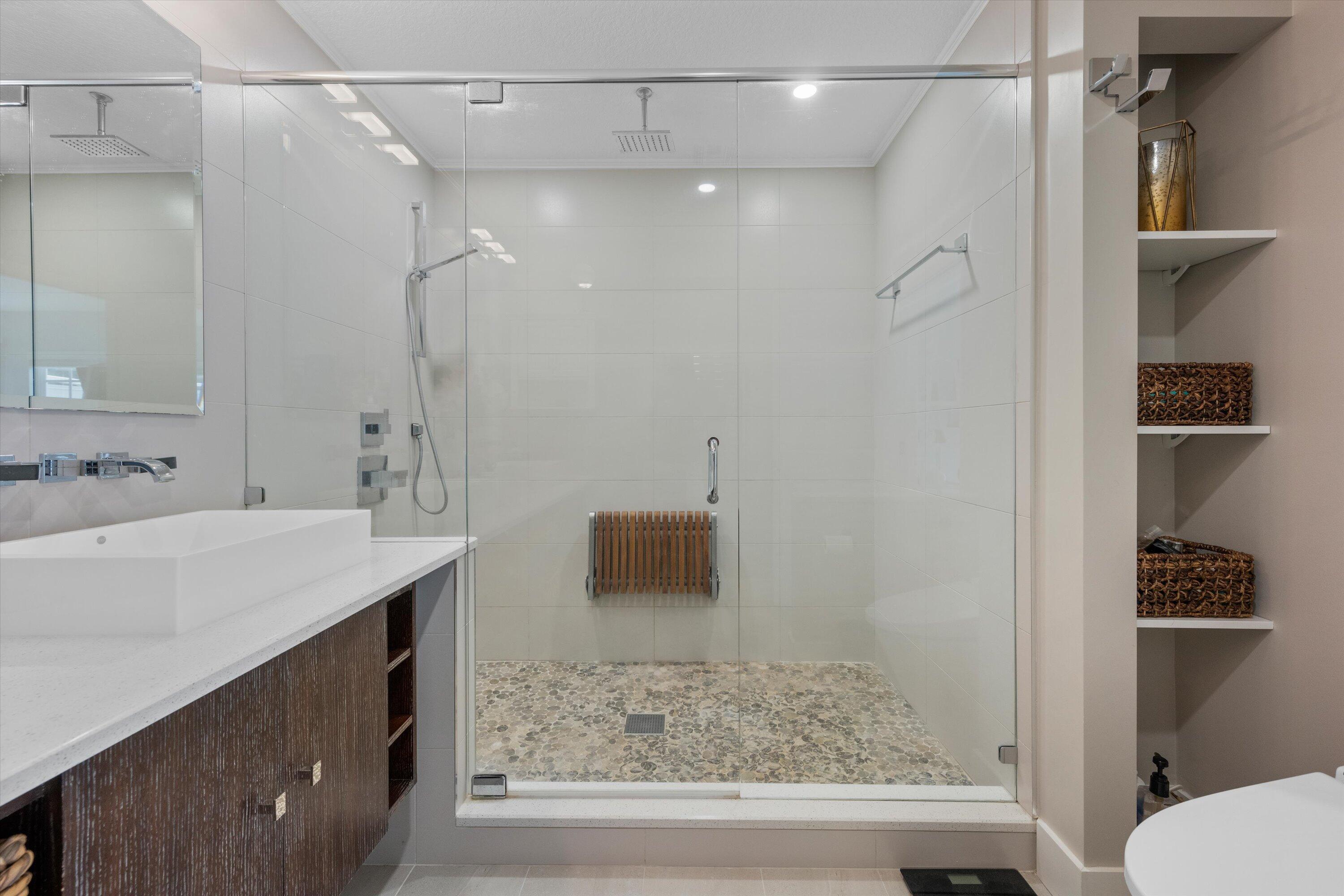 8878 Southeast Riverfront Terrace Jupiter, FL 33469 - Photo 28 of 57 a bathroom with a sink and a mirror