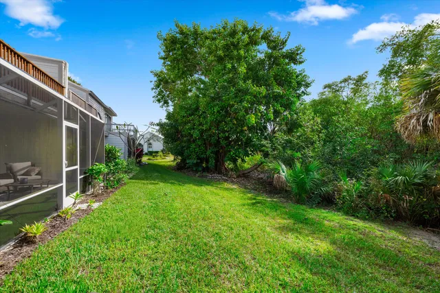 an aerial view of a house with yard swimming pool and outdoor seating