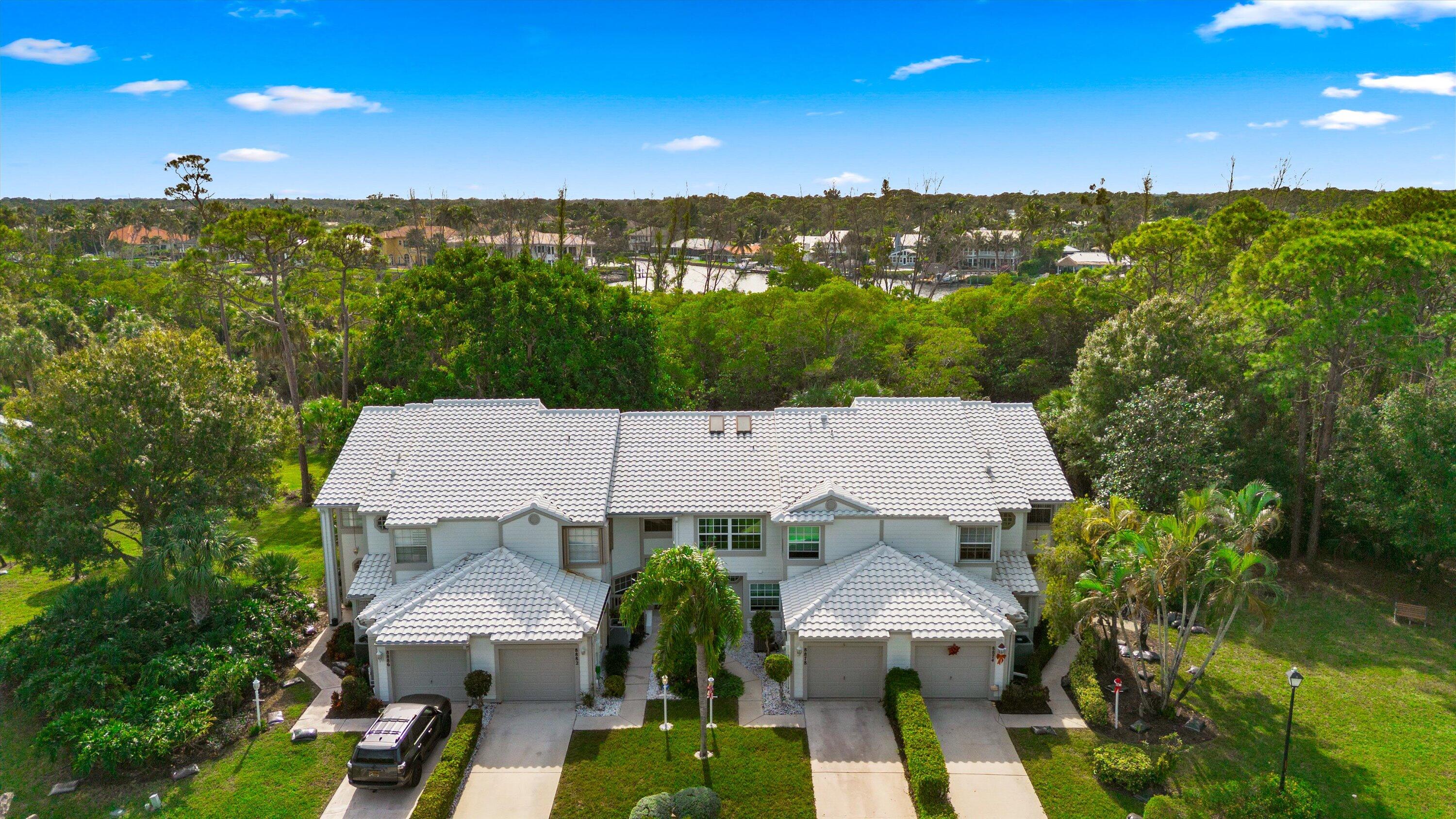 8878 Southeast Riverfront Terrace Jupiter, FL 33469 - Photo 42 of 57 an aerial view of a house with yard swimming pool and outdoor seating