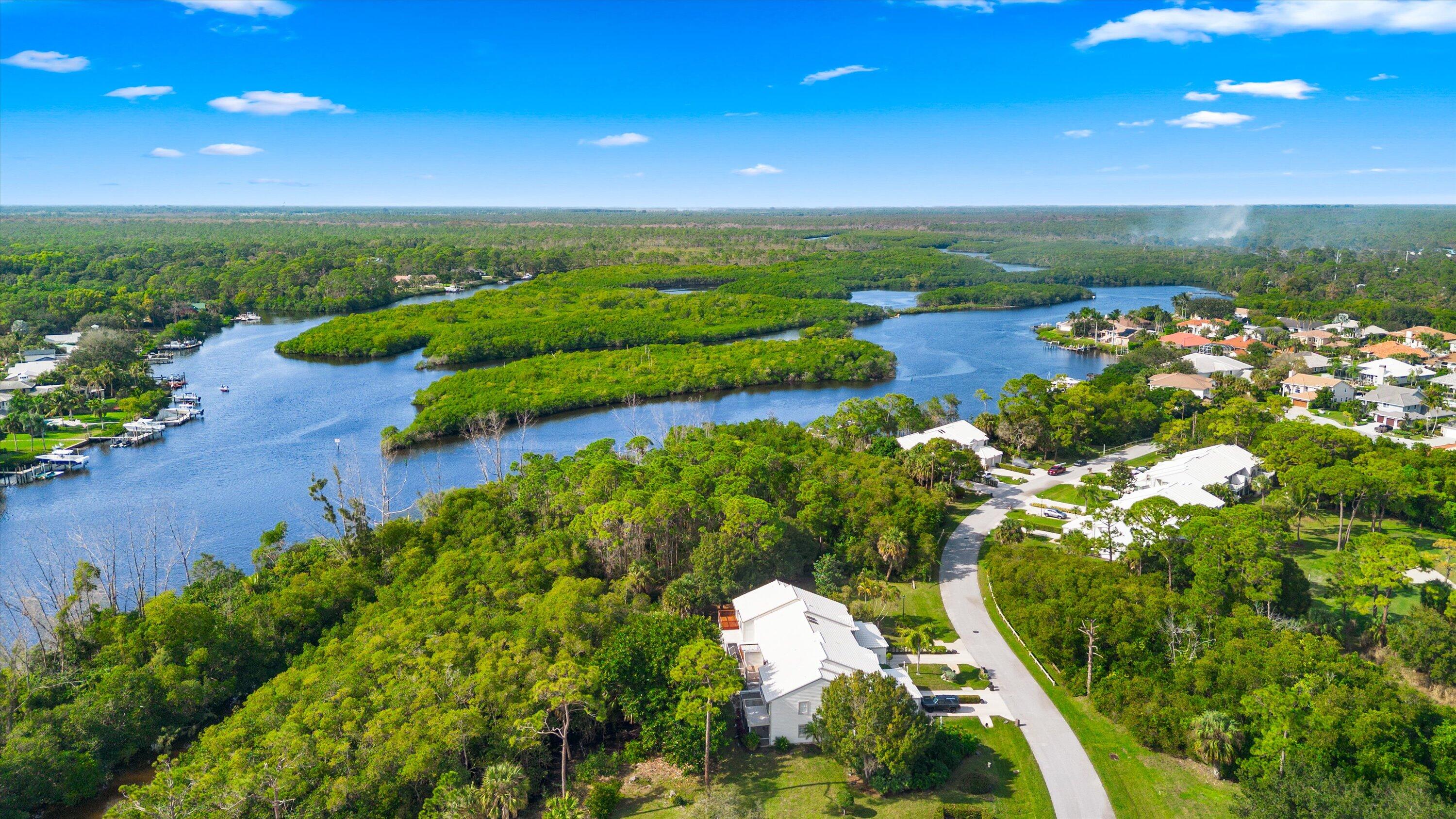 8878 Southeast Riverfront Terrace Jupiter, FL 33469 - Photo 51 of 57 a view of a lake with a city