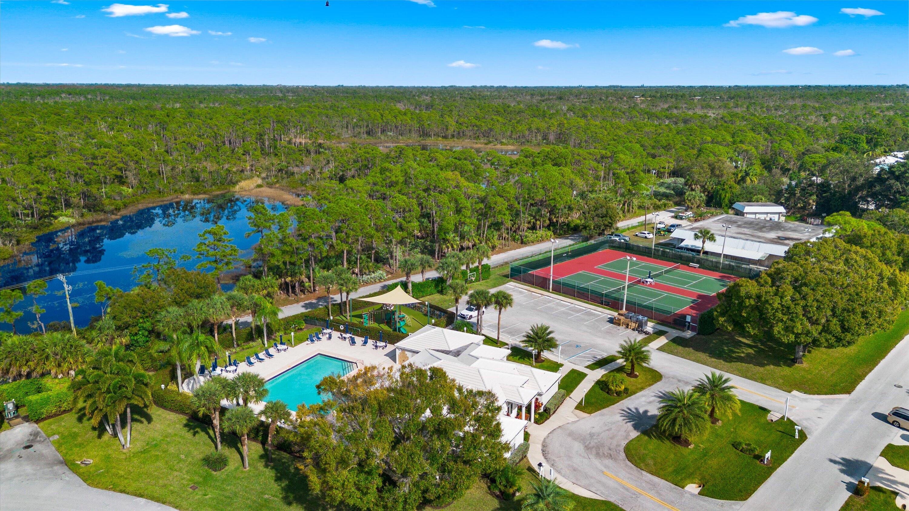 8878 Southeast Riverfront Terrace Jupiter, FL 33469 - Photo 53 of 57 a view of an outdoor space and a yard