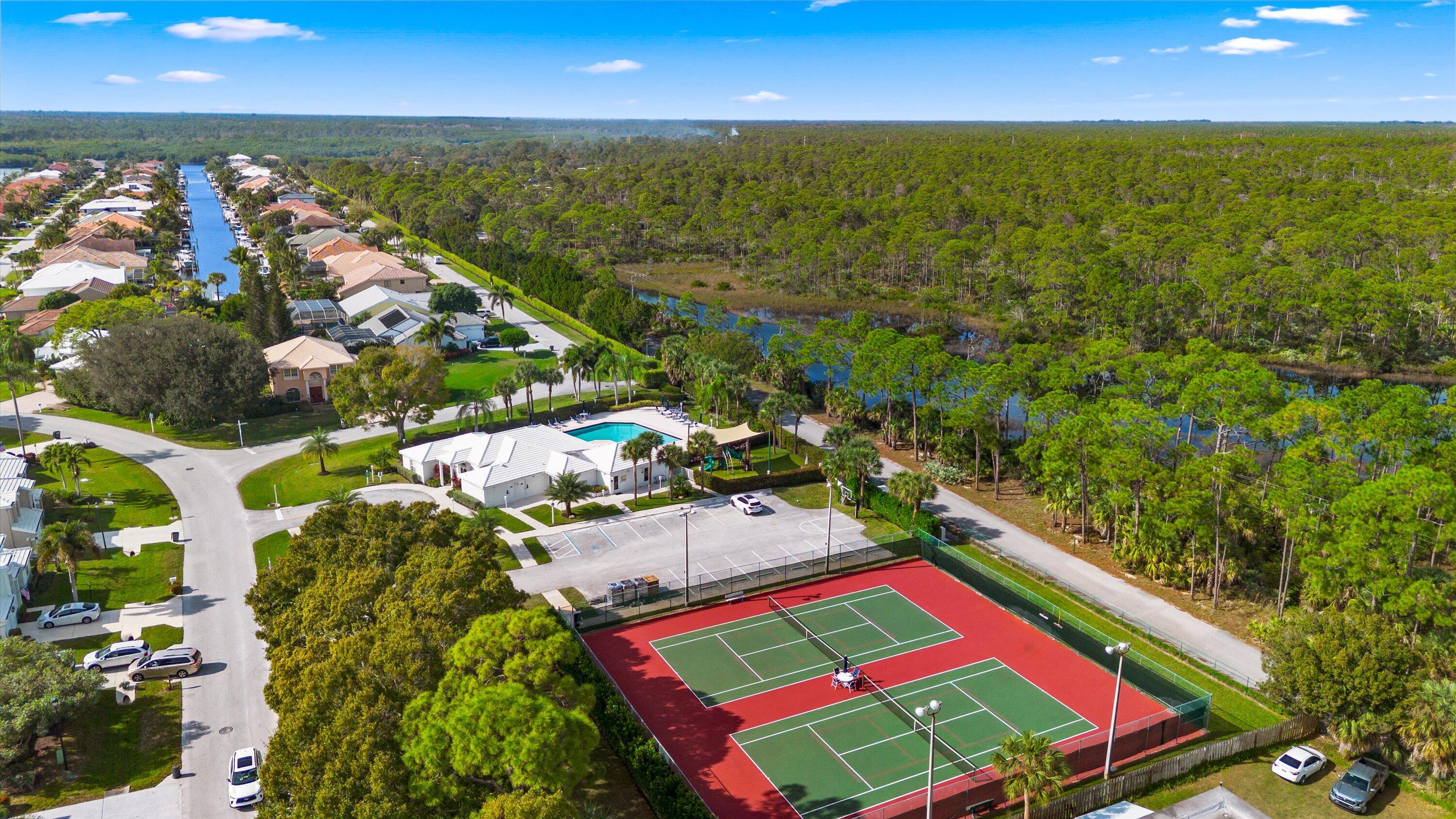8878 Southeast Riverfront Terrace Jupiter, FL 33469 - Photo 54 of 57 an aerial view of tennis court