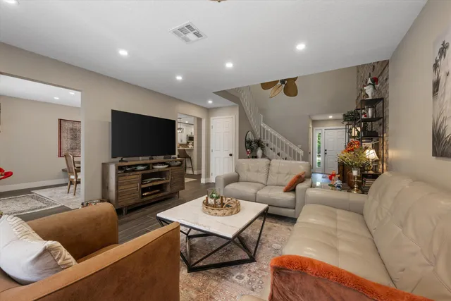 a dining room with furniture and window