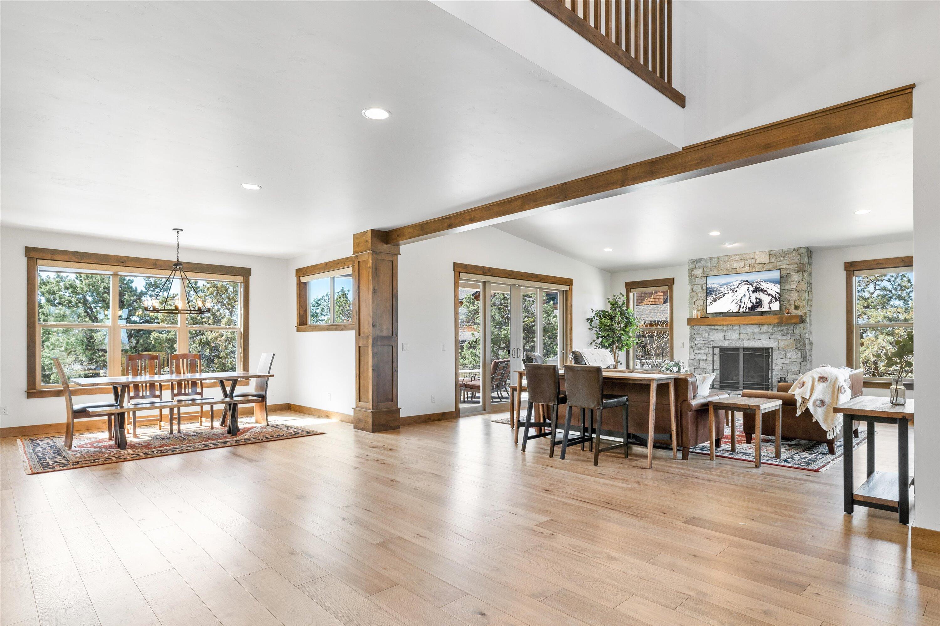 15687 Southwest Brasada Rnch Road Powell Butte, OR 97753 - Photo 10 of 73 a view of a livingroom with furniture wooden floor and windows