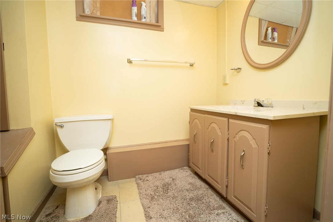 453 Omar Street Struthers, OH 44471 - Photo 24 of 27 Bathroom with vanity and light tile patterned flooring
