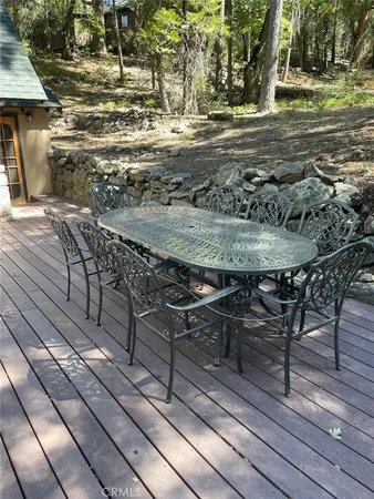a view of a backyard with wooden floor