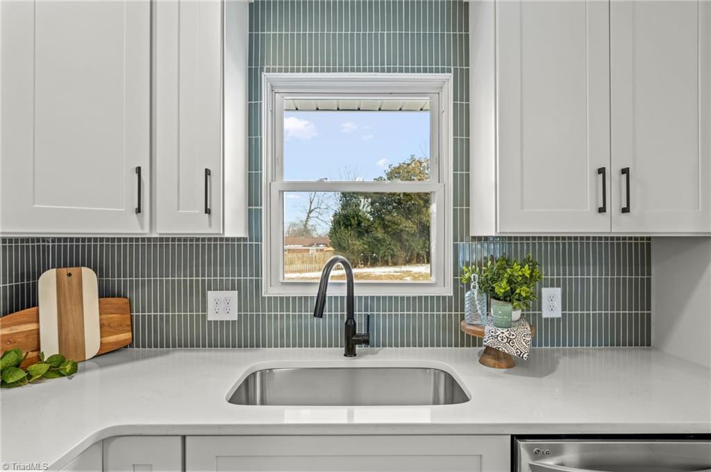 3856 Azalea Lane Trinity, NC 27370 - Photo 7 of 39 Farmhouse sink overlooks fenced yard