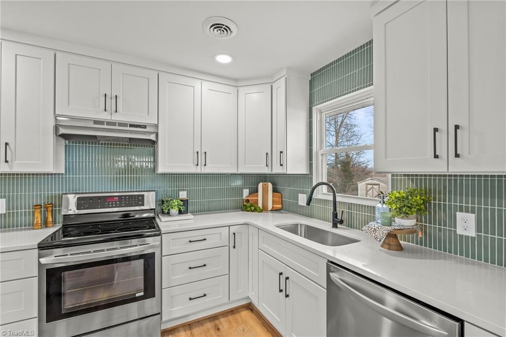 3856 Azalea Lane Trinity, NC 27370 - Photo 9 of 39 This gorgeous Green hue backspash is the Kitchen "Star"!