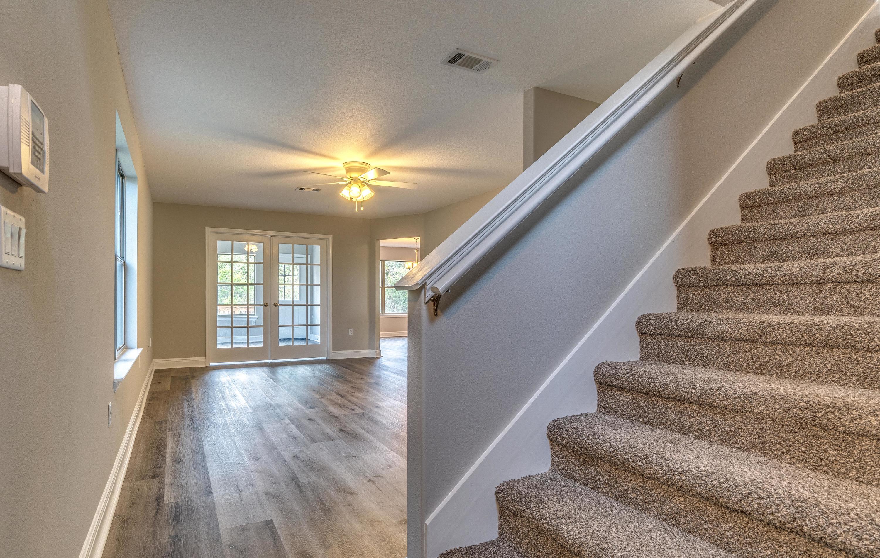 129 Bronze Circle Crestview, FL 32539 - Photo 16 of 31 a view of entryway and hall with wooden floor