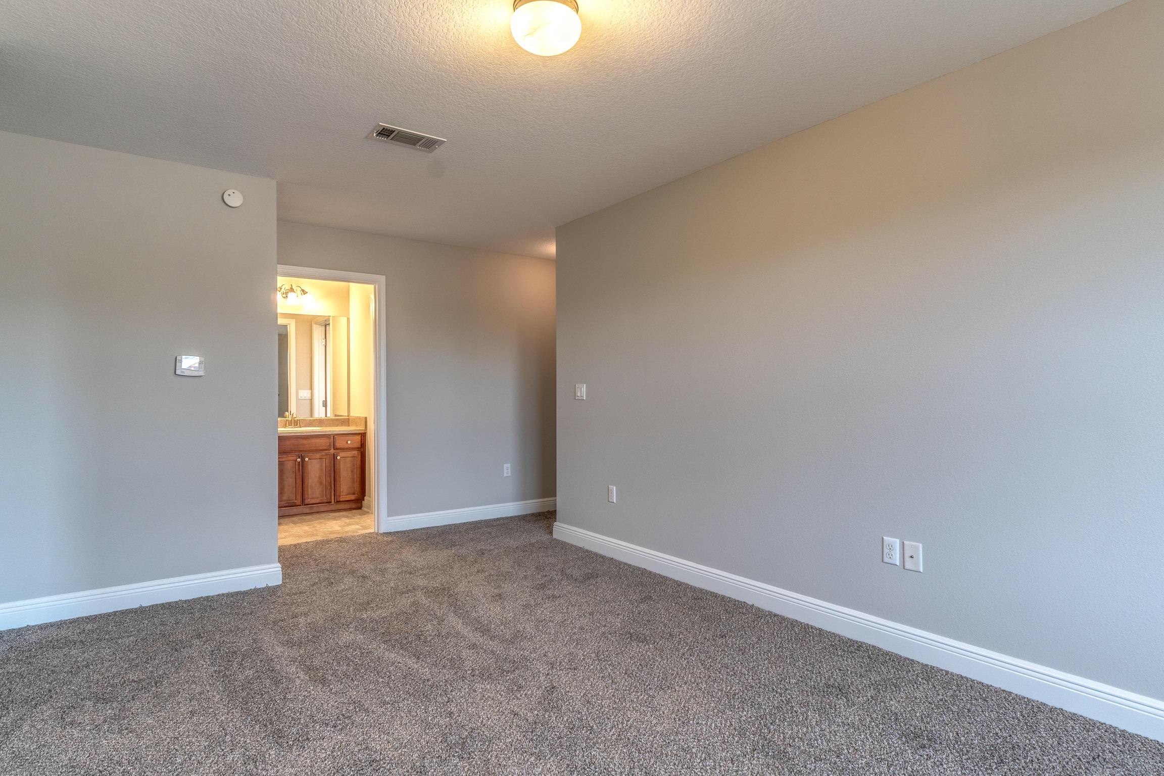 129 Bronze Circle Crestview, FL 32539 - Photo 20 of 31 an empty room with windows