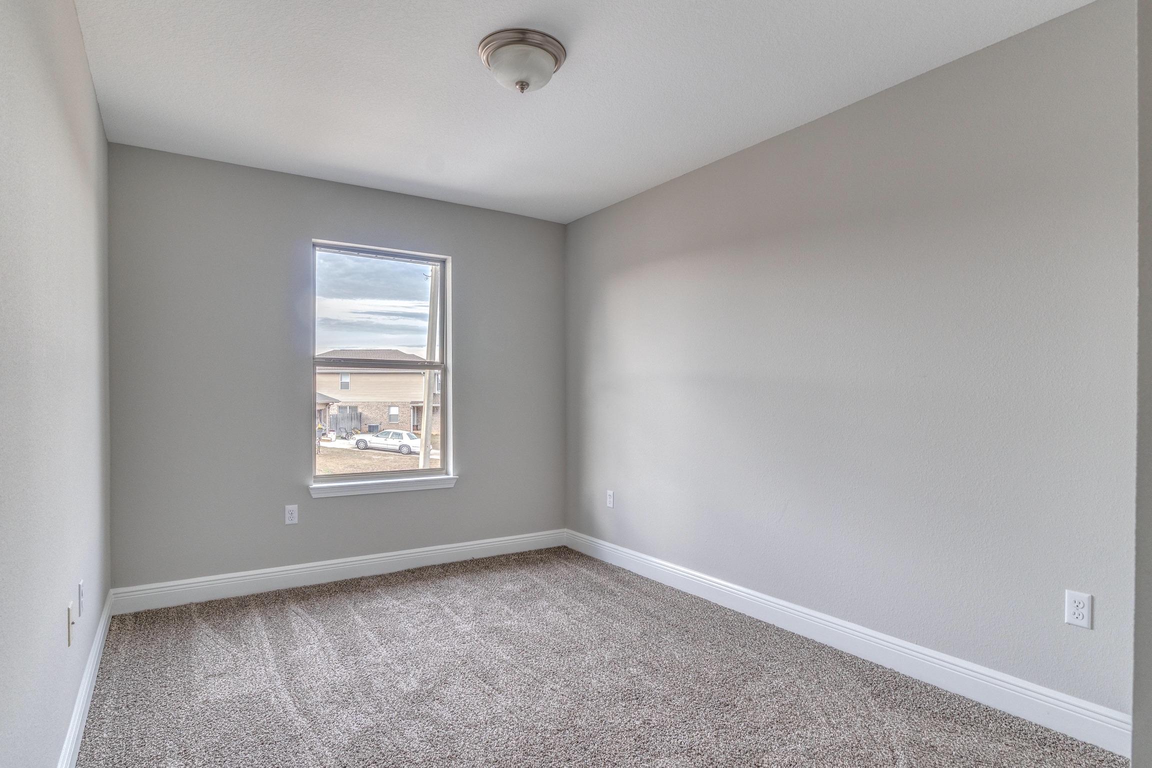 129 Bronze Circle Crestview, FL 32539 - Photo 21 of 31 an empty room with a window
