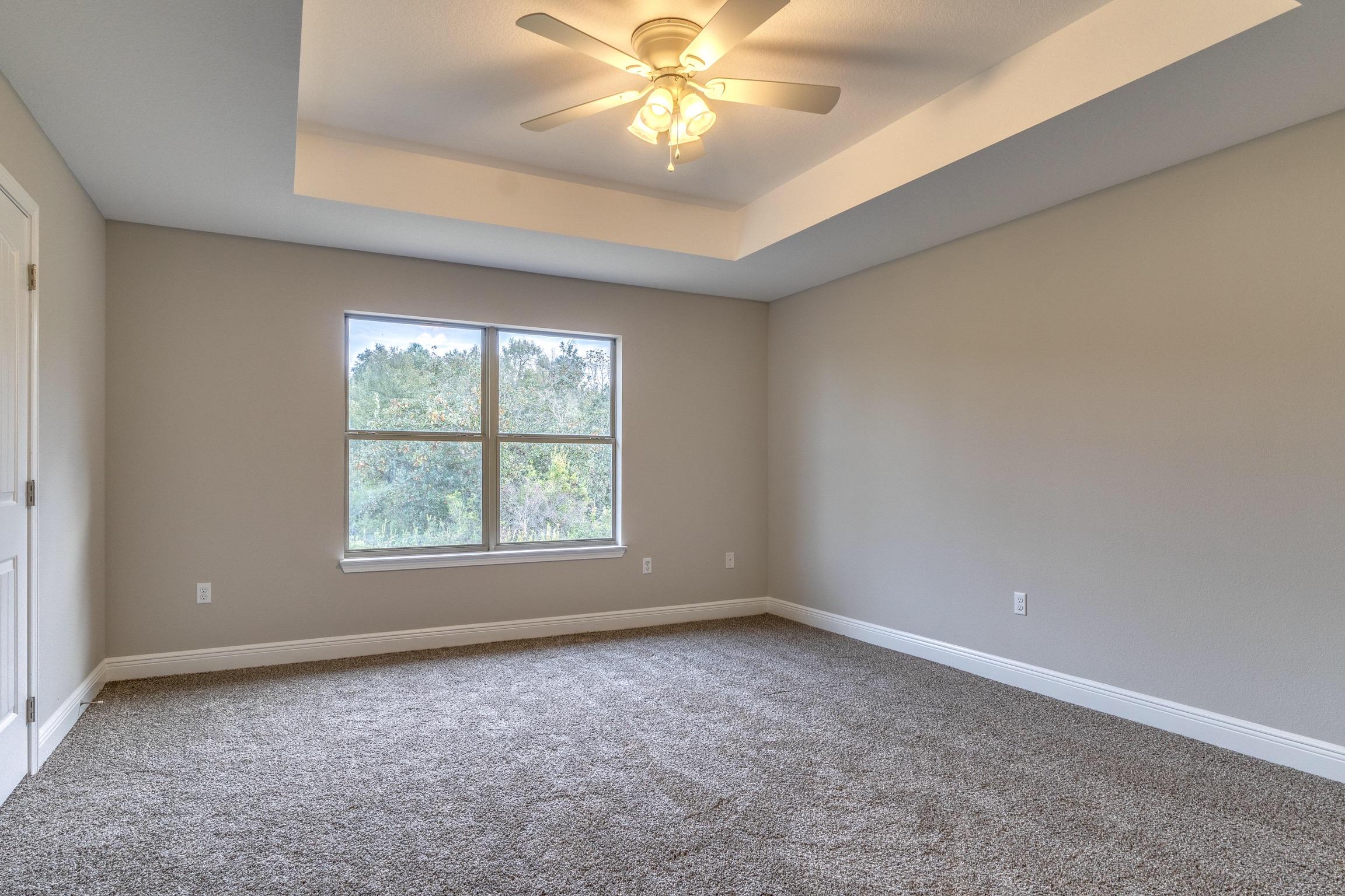 129 Bronze Circle Crestview, FL 32539 - Photo 27 of 31 an empty room with a window and a fan