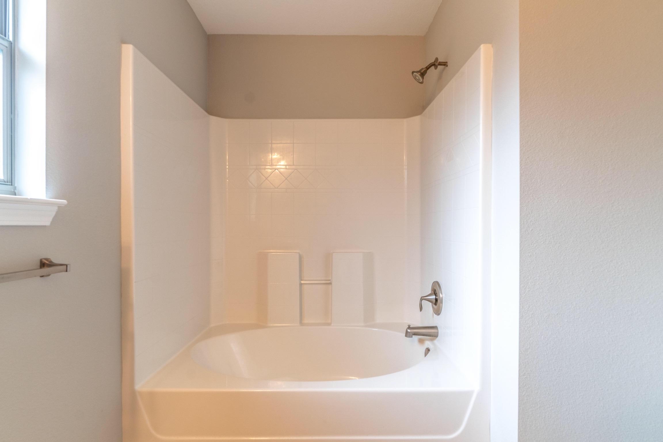 129 Bronze Circle Crestview, FL 32539 - Photo 30 of 31 a bathroom with a bathtub