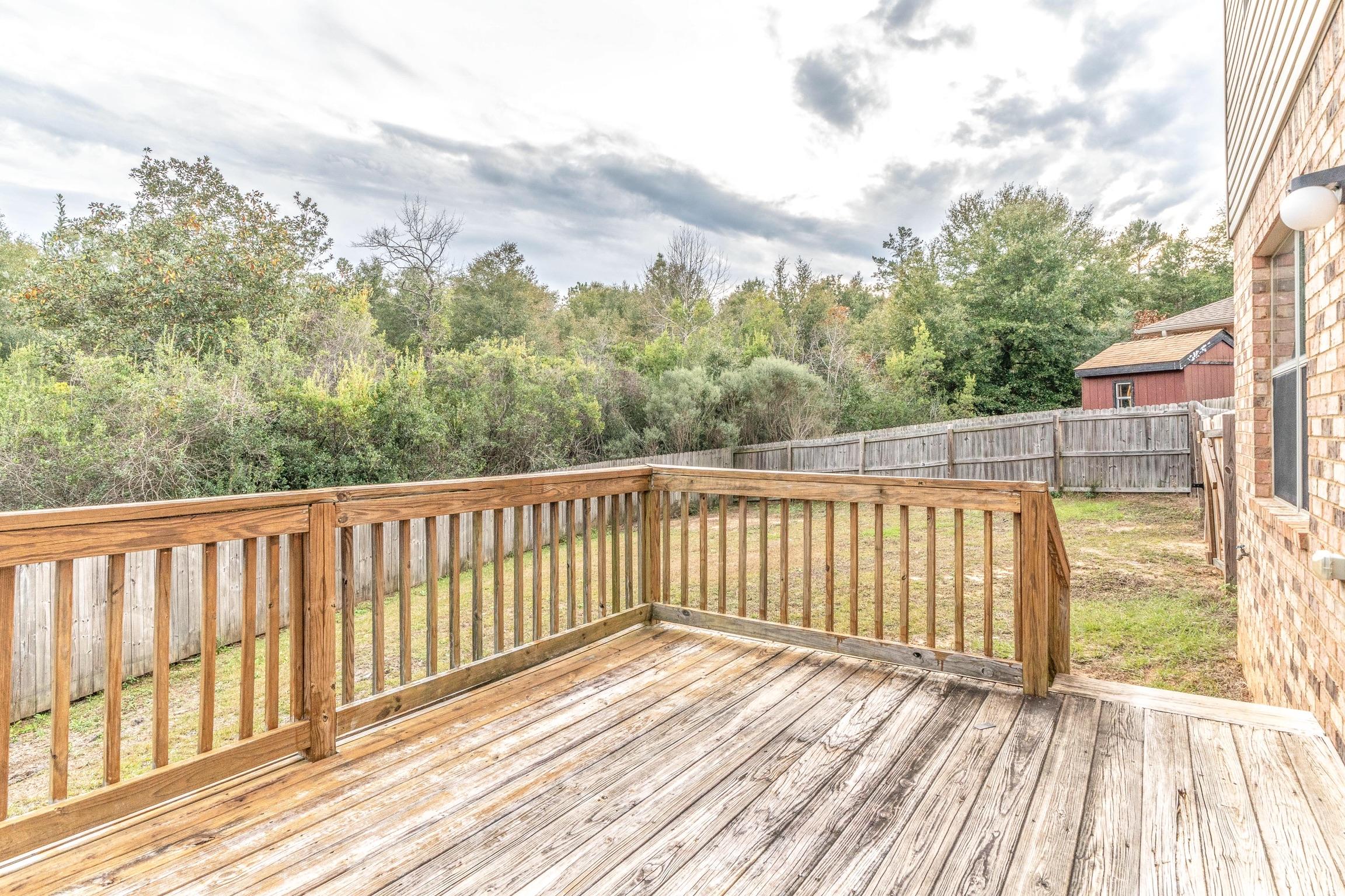 129 Bronze Circle Crestview, FL 32539 - Photo 31 of 31 a view of balcony with wooden floor