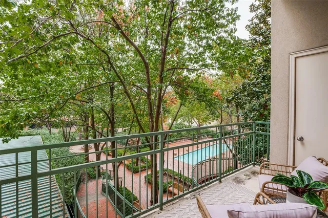 a view of a balcony with wooden floor