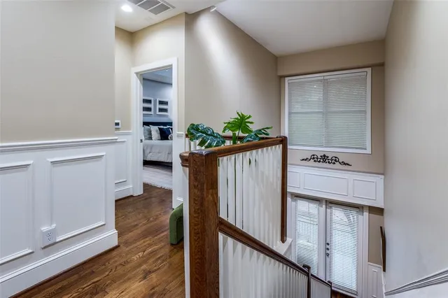 a view of washer and dryer with wooden floor
