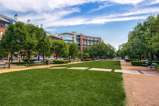 a view of a swimming pool with a yard and a fountain